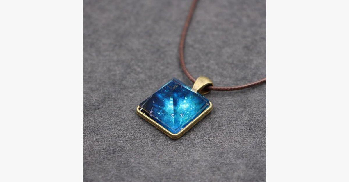 Glowing Pyramid Pendant with Blue Crystal – Add Some Shine and Color To Your Collection